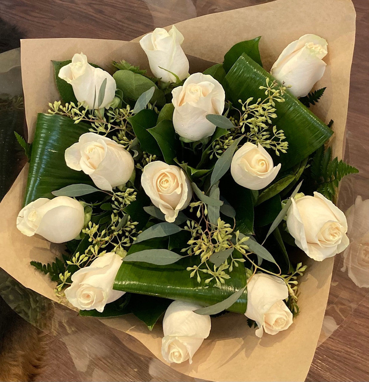 Dozen Roses with Lush Greenery
